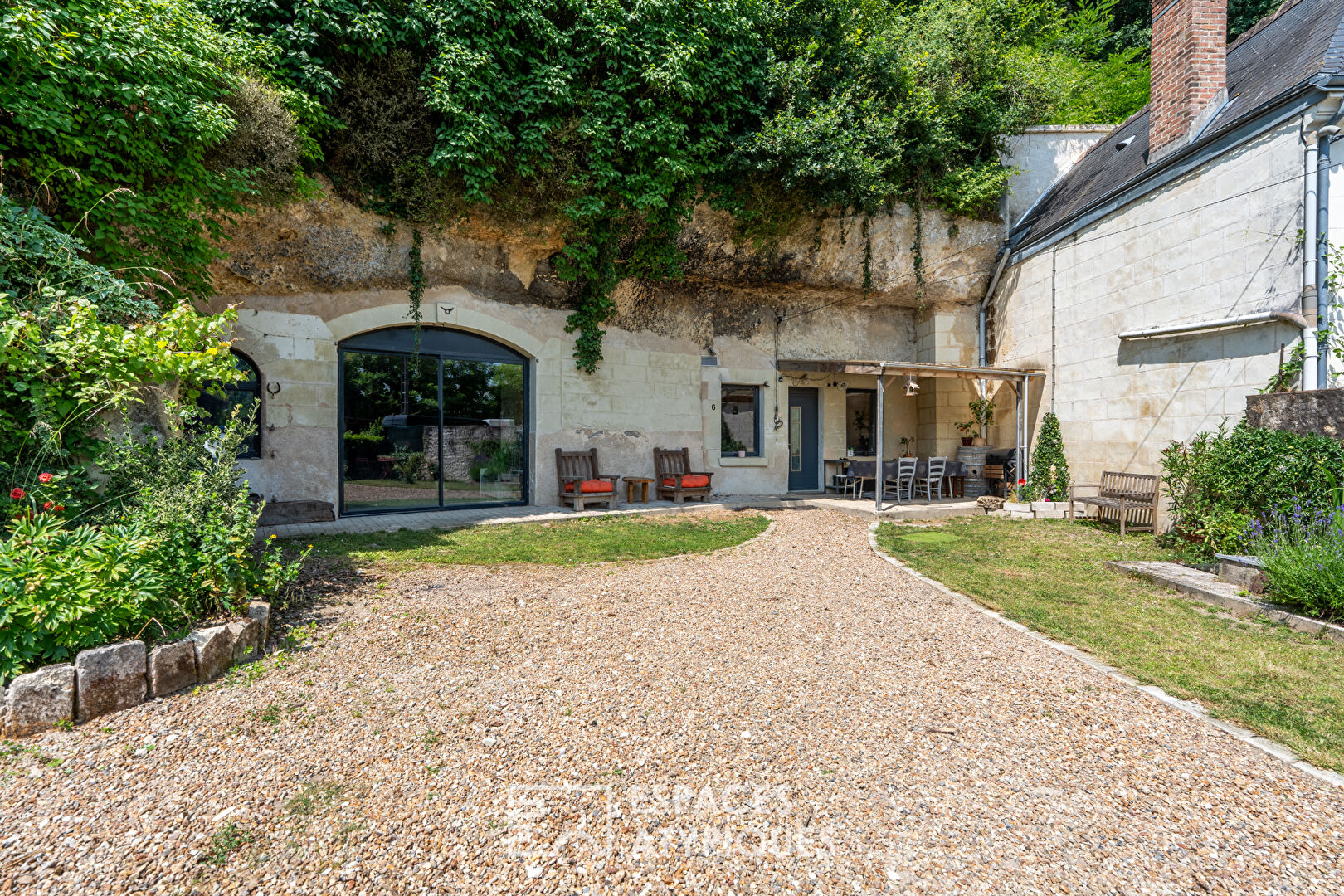 Troglodyte living meets French country charm east of Tours, where stone walls and garden views frame a surprisingly bright and spacious 3-bedroom home. Naturally temperate year-round, the 250 sqm interior includes a generous living area with wood-burning stove, a kitchen, full bathroom, and an additional room to renovate. Offered at €235,000, the property also features a 100 sqm cellar and 1,127 sqm of outdoor space for relaxing or gardening. Just five minutes from shops, school, and transport links, it offers both privacy and convenience with a rare, authentic character.